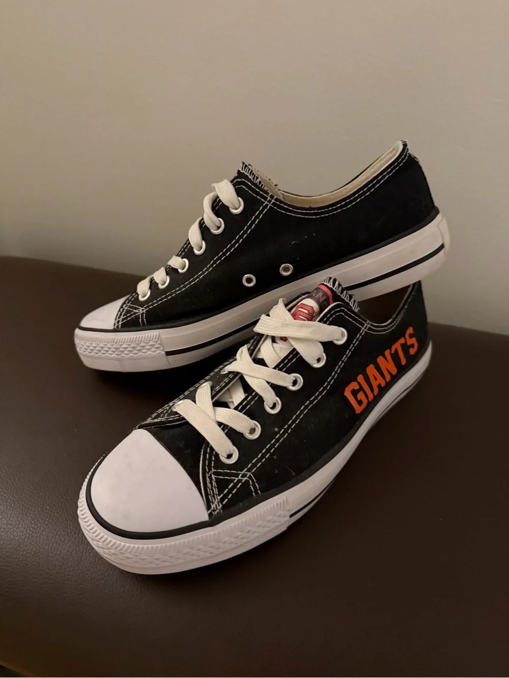 Black Low-Top Athletic Sneakers with Orange 'GIANTS' Accent